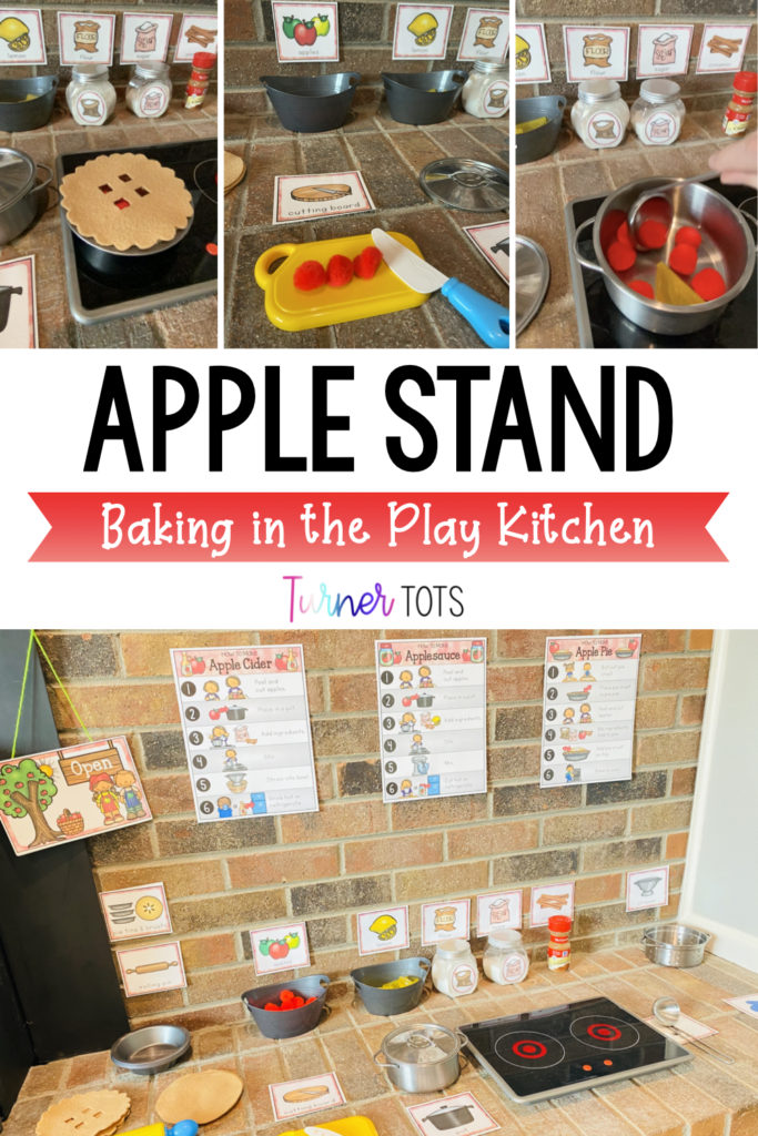Apple stand play kitchen area set up with stove top, cutting board, red pompom apples, pots, pie tins, and directions on how to make applesauce, apple cider, and apple pie.