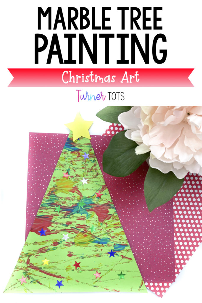 Marble tree painting includes a picture of a triangle tree cut out painted with marbles.
