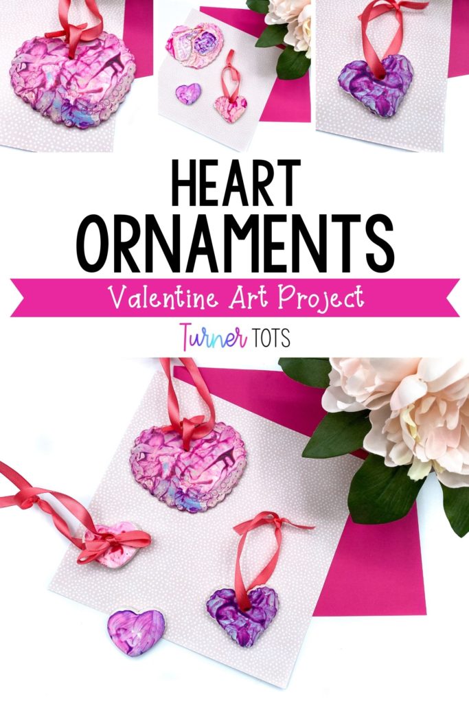 Painted heart ornaments with ribbon for Valentine's Day art for toddlers.