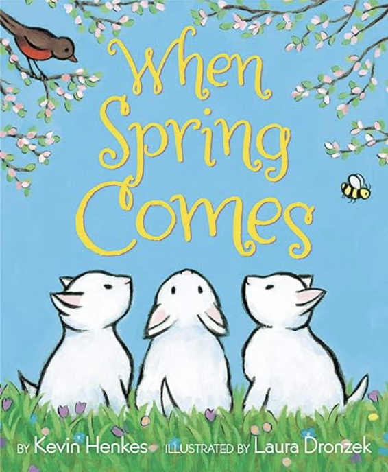 When Spring Comes by Kevin Henkes includes an illustrated cover of three white kittens looking up at springtime blossoms with a robin in the tree.